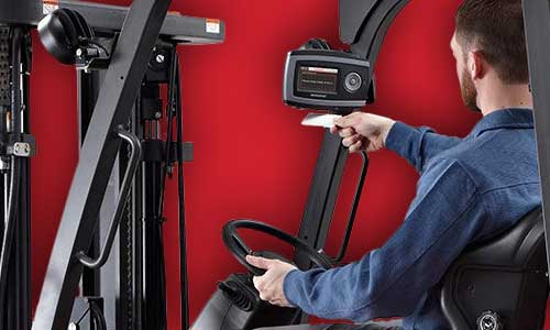 Forklift operator scans badge to access iWAREHOUSE Evolution forklift fleet management telematics platform